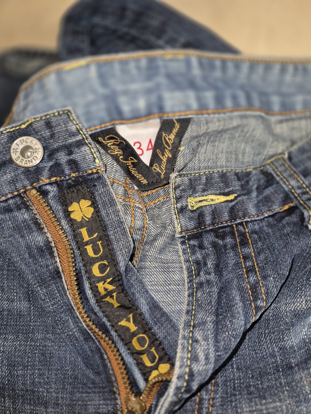 Lucky Brand Men's Blue Slim Straight Jeans with Yellow Accents